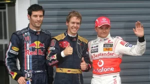 Pole position de Sebastian Vettel, Gran Premio de Italia 2008. A la izquierda Mark Webber, a la derecha Heikki Kovalainen.